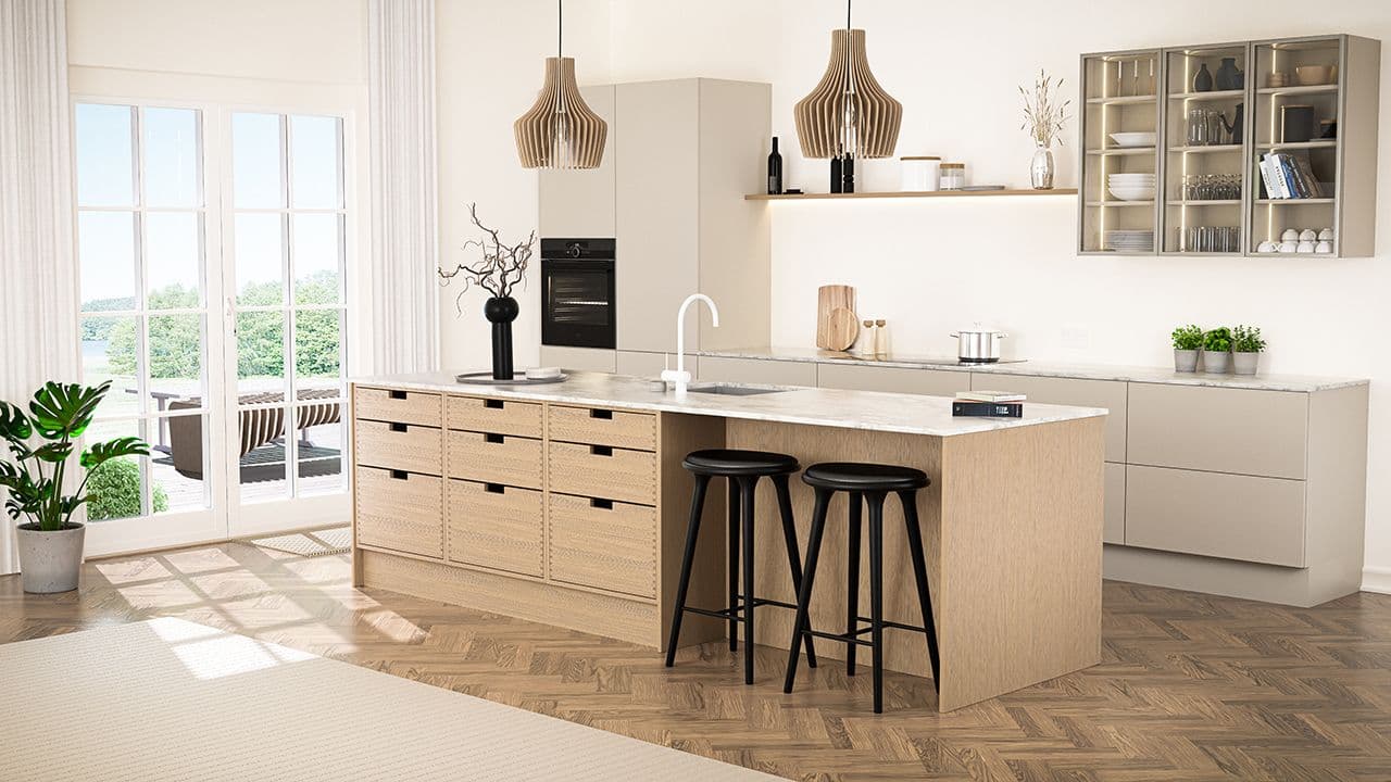 Åpen kjøkkenløsning med stor kjøkkenøy med barstoler og oppbevaring.